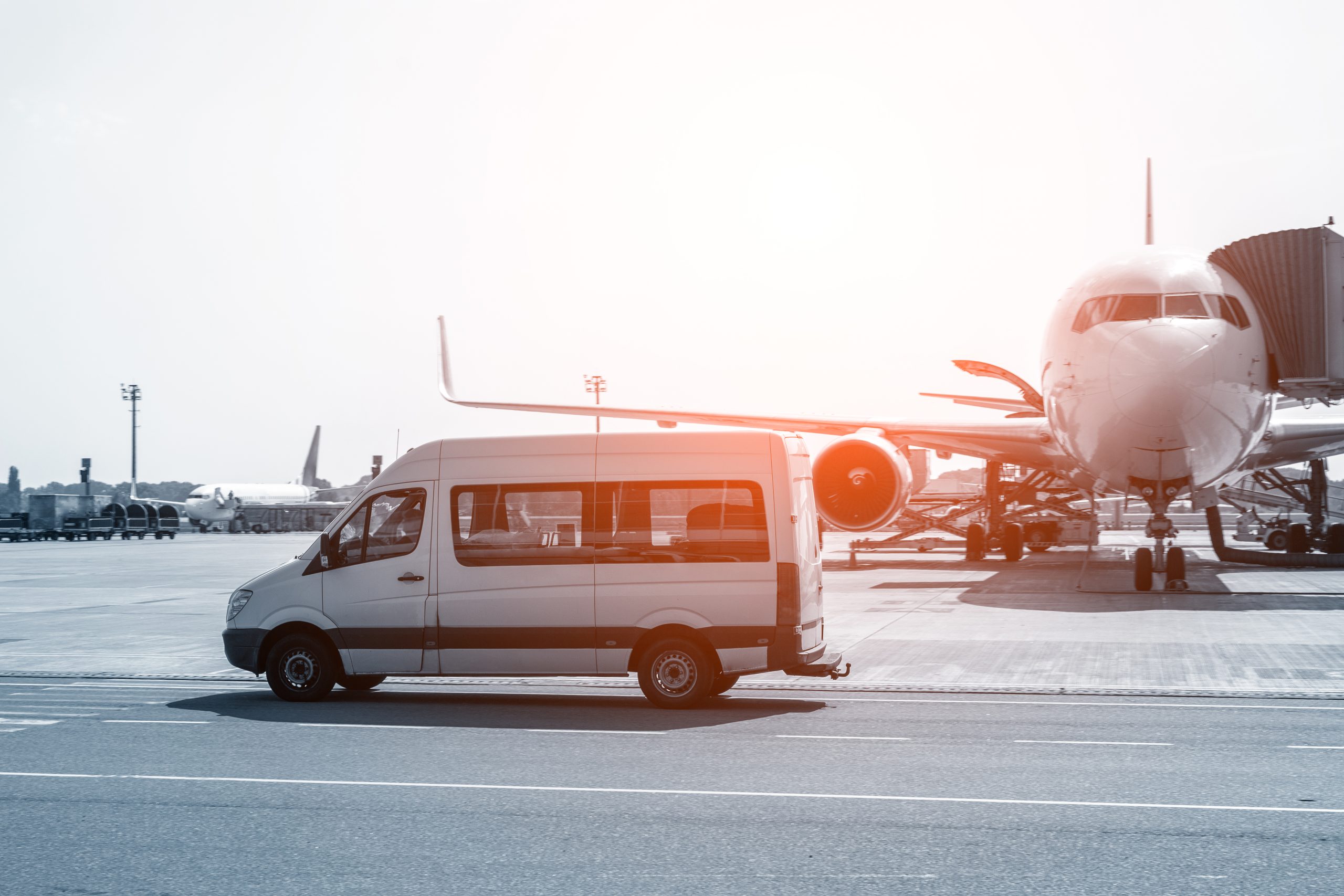 White,Vip,Service,Van,Running,On,Airport,Taxiway,With,Big